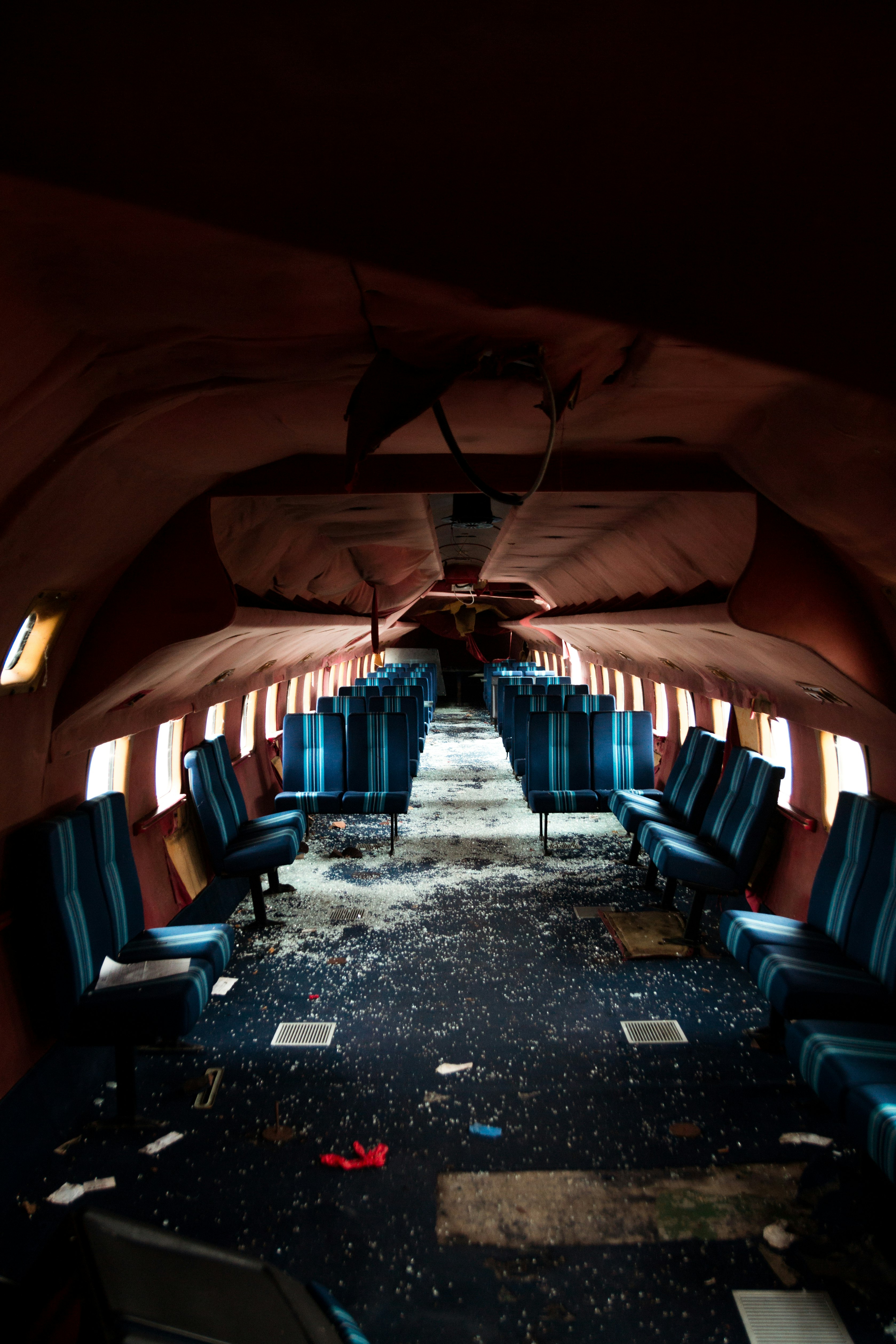 blue and brown wooden chairs inside a tunnel